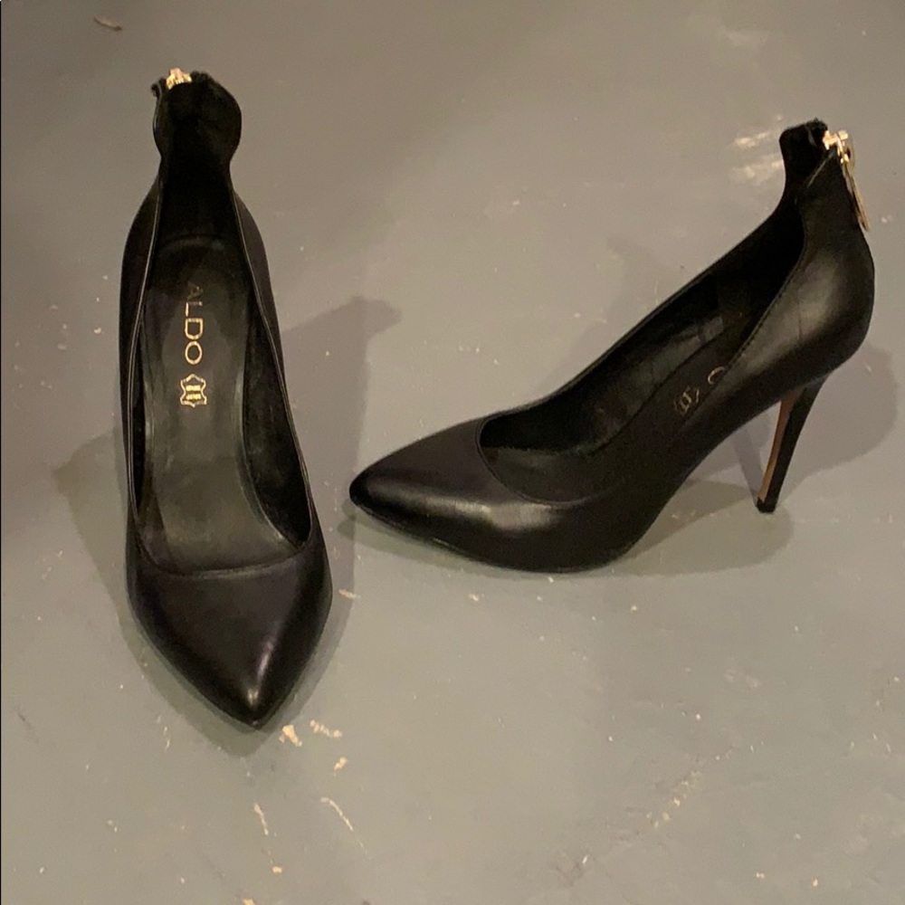 Black pumps with gold zipper up the back